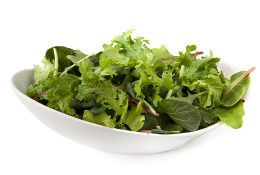 Bowl of mixed salad leaves, isolated on white. Bowl of mixed salad leaves, isolated on white.